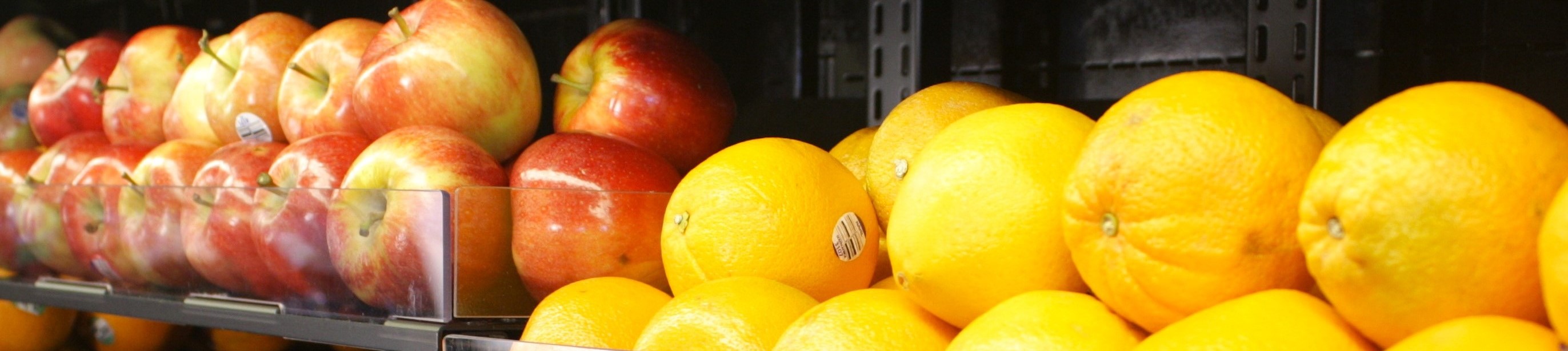 Apples and oranges set beside each other in a perspective showcasing the depth and analogous color duality. 